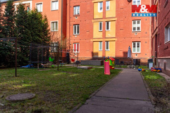 Prodej bytu 1+1 o užitné ploše 46 m² v cihlovém domě v širší