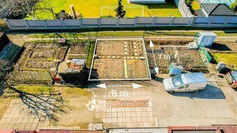 Ev.č. MZ26025 Řadový rodinný dům o dispozici 4+kk s garáží a