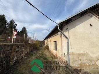 Ev.č. 02882 Řadový bytový dům v klidné části města. Ke koupi