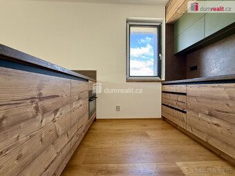 BENEFIT - New kitchen unit including appliances, garage parking space and ski storage room…
