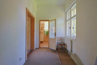 For sale is a smaller half of a house with 2 residential units, garden and parking – Kořenov…