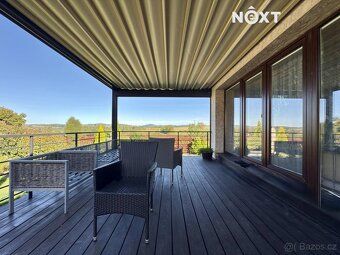 Under exclusive representation we offer an exceptional, modern, recently built family house 6+kitchenette.