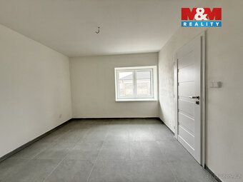 Nabízíme k prodeji krajní řadový rodinný dům 4kk v Podbořane