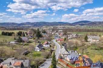 Looking for a place where you can literally have mountains behind your house?