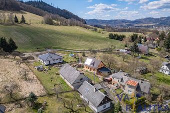 Looking for a place where you can literally have mountains behind your house?