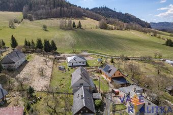 Looking for a place where you can literally have mountains behind your house?