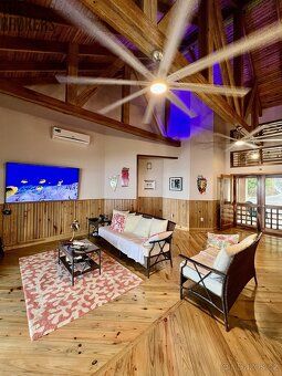 New Latitude is a modern island-style house with an exceptional view of the coral reef and Honduran mainland.