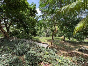 Small enclosed community nestled in rolling hills overlooking protected harbor waterways.