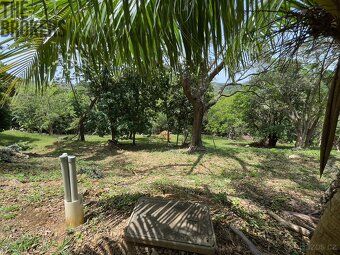 Small enclosed community nestled in rolling hills overlooking protected harbor waterways.