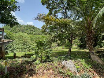 Small enclosed community nestled in rolling hills overlooking protected harbor waterways.
