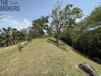 Small enclosed community nestled in rolling hills overlooking protected harbor waterways.