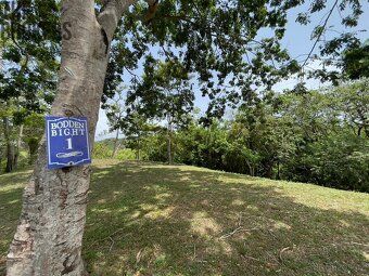 Small enclosed community nestled in rolling hills overlooking protected harbor waterways.