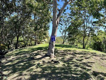 Small enclosed community nestled in rolling hills overlooking protected harbor waterways.