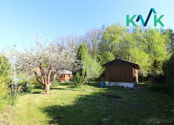 I am offering for sale a wooden cottage on a massive stone foundation
