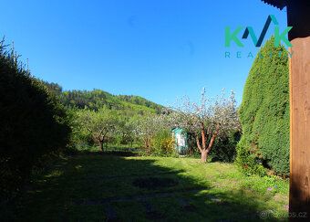 I am offering for sale a wooden cottage on a massive stone foundation