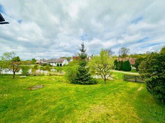 Offers for sale cottage in beautiful location by pond in village N