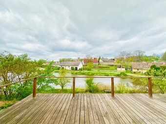 Offers for sale cottage in beautiful location by pond in village N