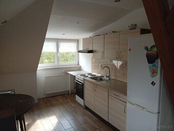 Rent new attic flat 2+kk, second floor, partially furnished, spacious bathroom.