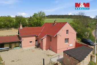 We offer for sale a detached family house with land