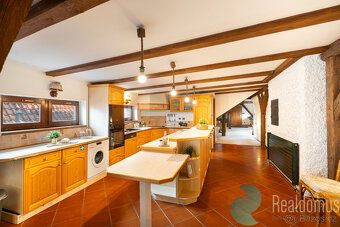 This exceptional attic apartment represents a unique combination of historical charm and modern comfort.