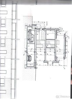 This is a terraced house completed by an attic penthouse with terraces