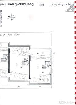 This is a terraced house completed by an attic penthouse with terraces