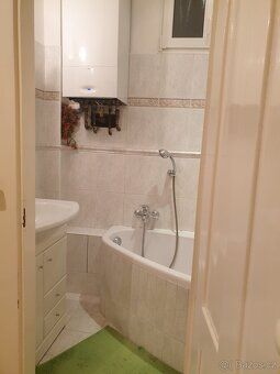 I offer bright, non-pass through, furnished room of approx. size 2