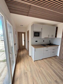 I am offering for sale a stylish, technologically advanced wooden house