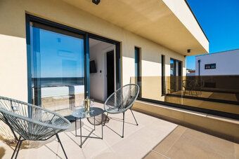 LaHoREAL offers for sale a new modern villa with pool and sea view in Maslenica