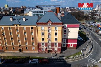 Prodej bytu 1+1 o užitné ploše 46 m² v cihlovém domě v širší