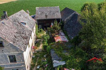 We offer for sale an interest in a family house and land plots in Ju