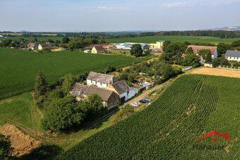 We offer for sale an interest in a family house and land plots in Ju