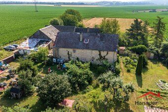 We offer for sale an interest in a family house and land plots in Ju