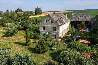 We offer for sale an interest in a family house and land plots in Ju