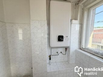 Prodej bytu 1+1 se zahradou v baťovském čtvrtdomku – zajímav