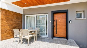 Moderní apartmán 1+1 se soukromou zahradou v oblíbeném rezid