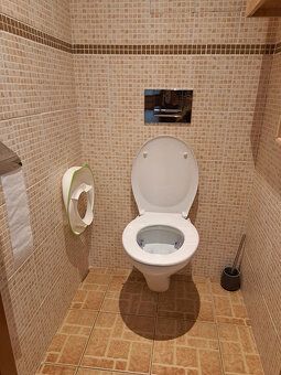 Apartment has undergone partial reconstruction and offers comfortable living for an extended family.