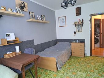 Apartment has undergone partial reconstruction and offers comfortable living for an extended family.