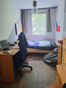 Apartment has undergone partial reconstruction and offers comfortable living for an extended family.