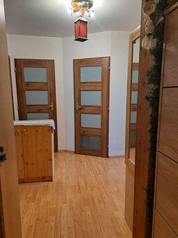 Apartment has undergone partial reconstruction and offers comfortable living for an extended family.