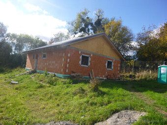 We offer for sale a rough construction of a family house on land in 
