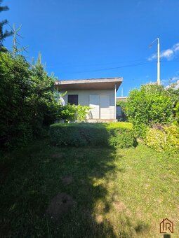 Brick semi-basement cottage with 4-acre garden in locality 