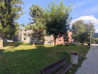 In a brick apartment house surrounded by pleasant