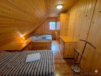 We offer for sale a two-story log cabin built in 2010