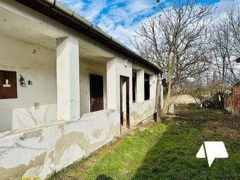 For sale land with an older family house in the city